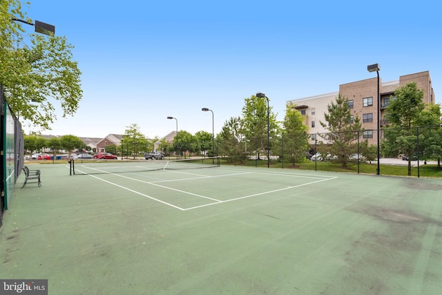 view of sport court with fence