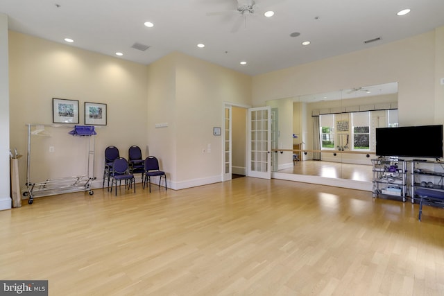 workout room featuring light wood-type flooring, visible vents, recessed lighting, french doors, and ceiling fan