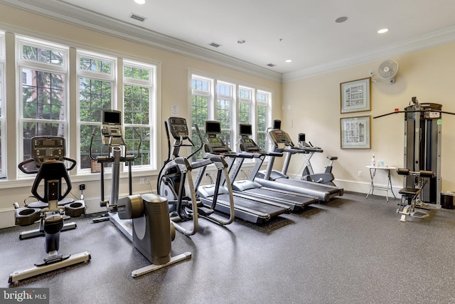 exercise room featuring crown molding, recessed lighting, baseboards, and visible vents