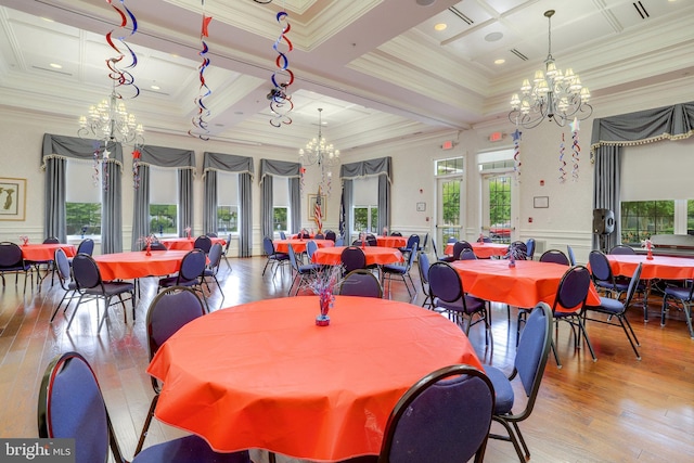 dining area featuring an inviting chandelier, plenty of natural light, and coffered ceiling