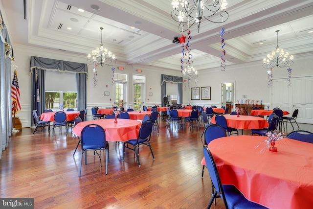 dining room featuring a notable chandelier, hardwood / wood-style floors, crown molding, and coffered ceiling