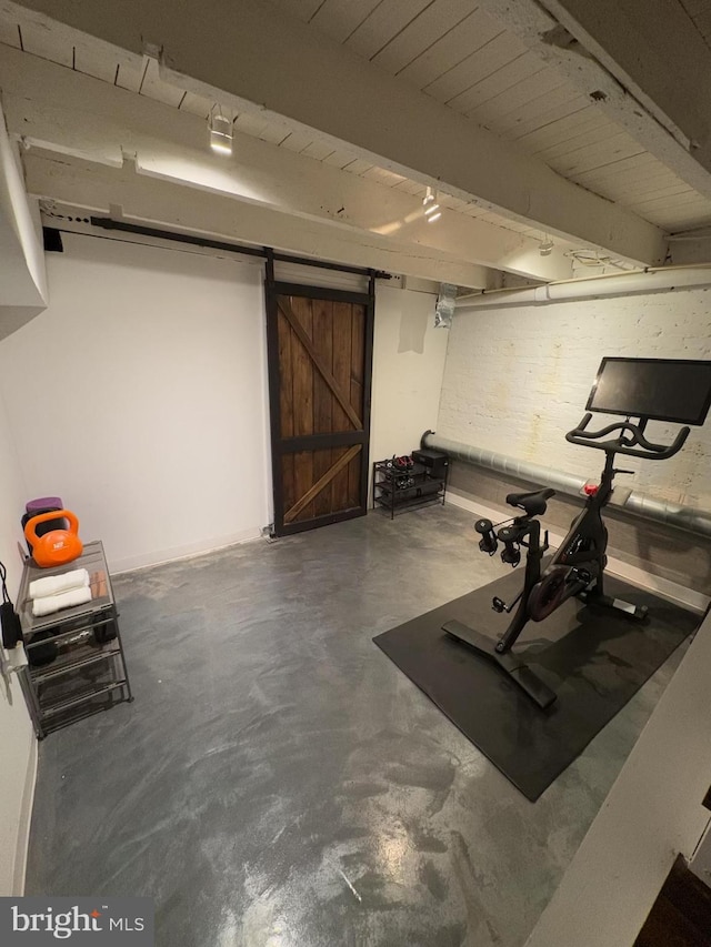 exercise room with a barn door