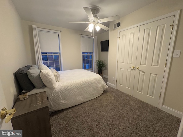 bedroom with dark carpet and ceiling fan