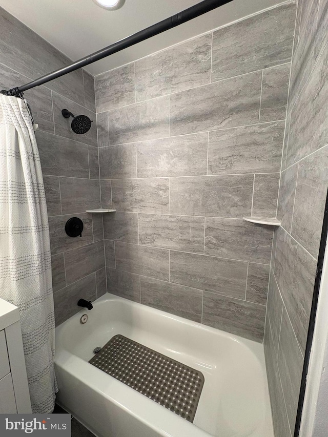 bathroom with shower / bath combination with curtain