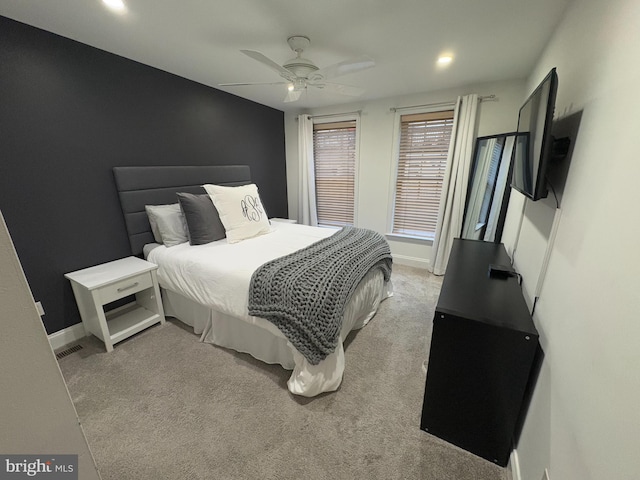 carpeted bedroom with ceiling fan