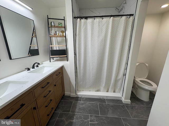 bathroom featuring a shower with curtain, vanity, and toilet