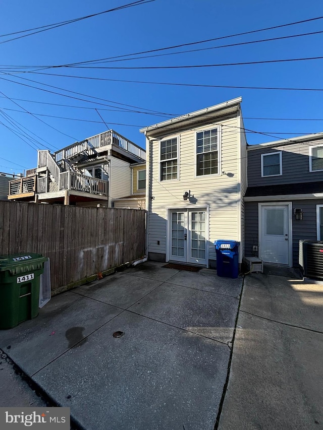 back of house featuring a patio and cooling unit