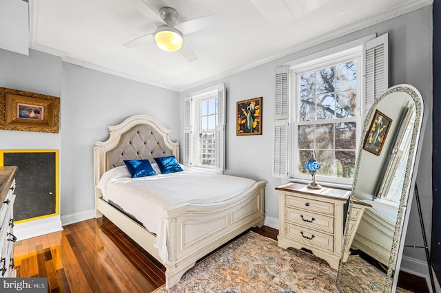 bedroom featuring hardwood / wood-style flooring, ceiling fan, and ornamental molding