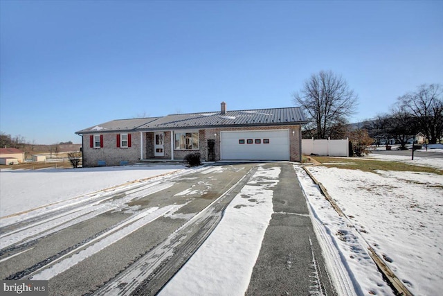 ranch-style home featuring a garage