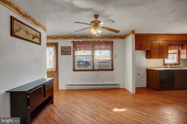 kitchen with dishwasher, light hardwood / wood-style floors, baseboard heating, cooling unit, and ceiling fan