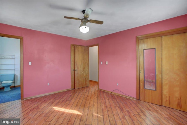 unfurnished bedroom featuring ceiling fan, light hardwood / wood-style flooring, and connected bathroom