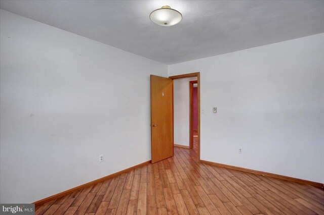 spare room with light wood-type flooring