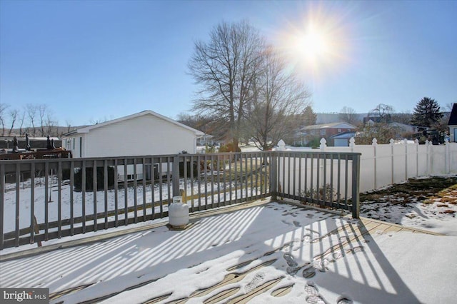 view of snow covered deck