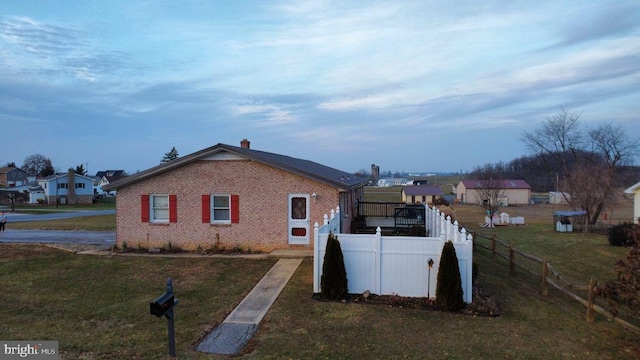 view of property exterior with a yard