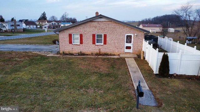 view of home's exterior featuring a yard