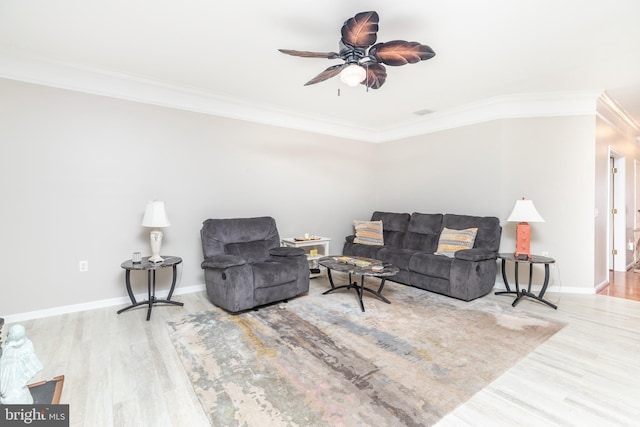 living room with ceiling fan, ornamental molding, and wood-type flooring