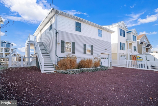 1427 Paul Blvd, Manahawkin, NJ 08050 - exterior space with stairs, an attached garage, fence, and a residential view