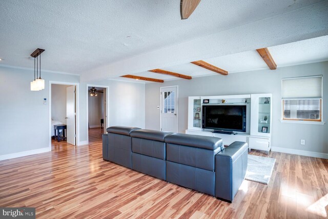 1427 Paul Blvd, Manahawkin, NJ 08050 - living area with baseboards, beamed ceiling, a textured ceiling, and light wood-style floors