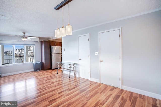 1427 Paul Blvd, Manahawkin, NJ 08050 - unfurnished living room featuring baseboards, a textured ceiling, crown molding, and light wood-style floors