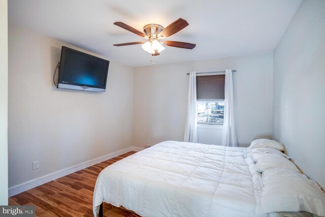 1427 Paul Blvd, Manahawkin, NJ 08050 - bedroom featuring baseboards, wood finished floors, and a ceiling fan