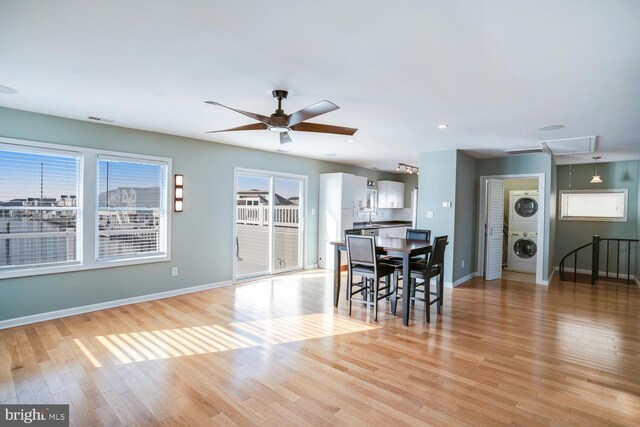 1427 Paul Blvd, Manahawkin, NJ 08050 - dining room featuring light wood finished floors, baseboards, attic access, stacked washer / drying machine, and a ceiling fan