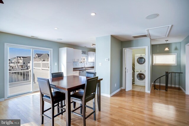 1427 Paul Blvd, Manahawkin, NJ 08050 - dining area with baseboards, attic access, light wood-style flooring, recessed lighting, and stacked washer / dryer