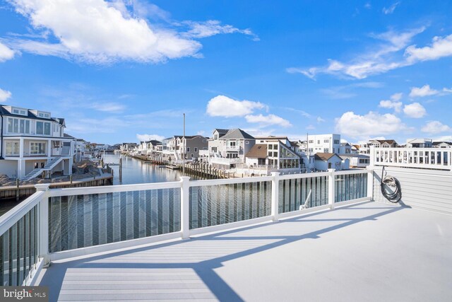 1427 Paul Blvd, Manahawkin, NJ 08050 - view of dock featuring a residential view and a water view