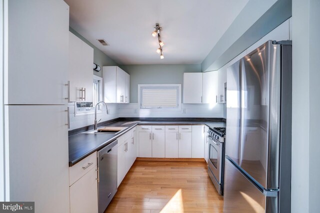 1427 Paul Blvd, Manahawkin, NJ 08050 - kitchen featuring a sink, visible vents, dark countertops, and appliances with stainless steel finishes