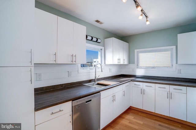 1427 Paul Blvd, Manahawkin, NJ 08050 - kitchen featuring a sink, visible vents, stainless steel dishwasher, and dark countertops