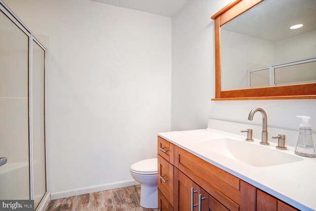 1427 Paul Blvd, Manahawkin, NJ 08050 - bathroom featuring vanity, toilet, wood finished floors, and a shower with shower door
