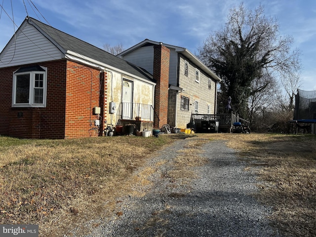 view of home's exterior featuring a trampoline