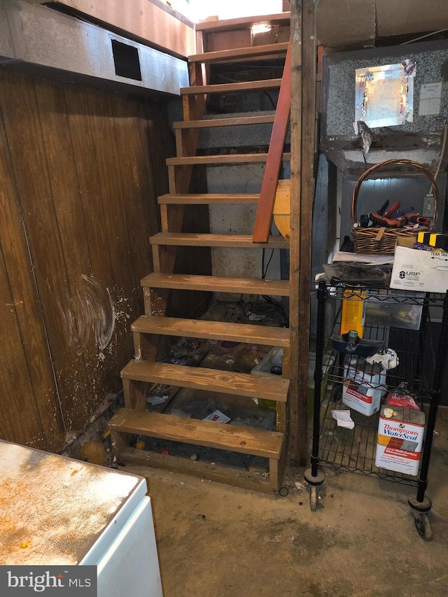 staircase with concrete floors