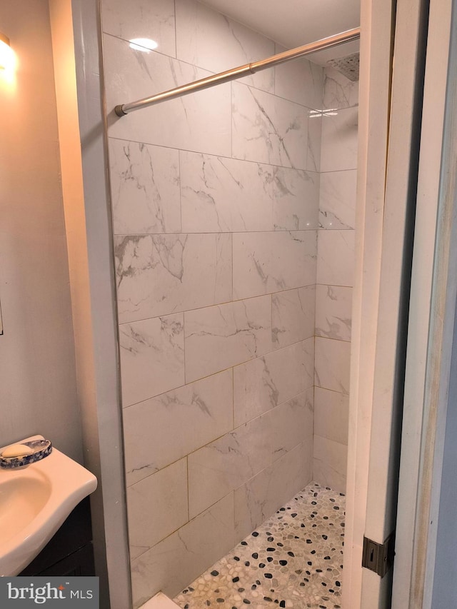 bathroom with tiled shower