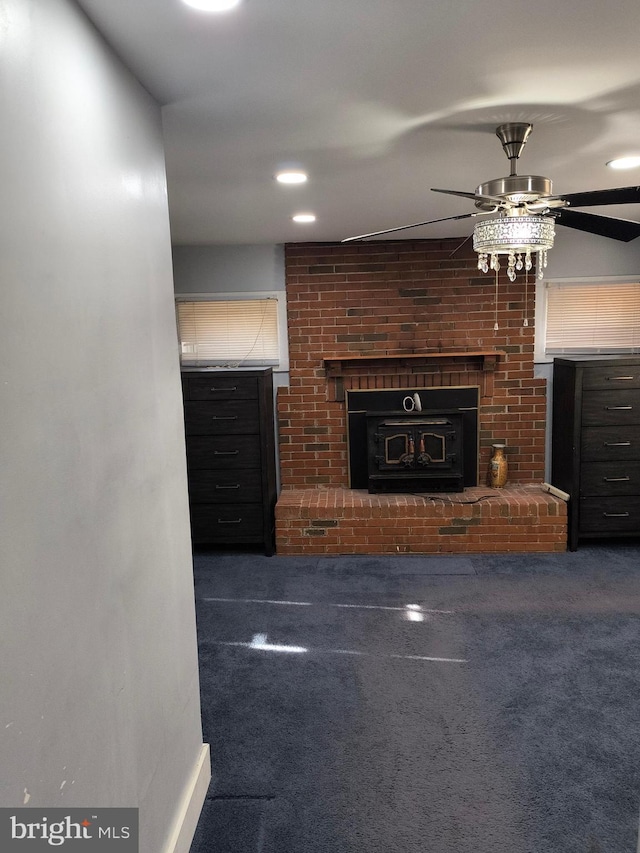 unfurnished living room featuring ceiling fan