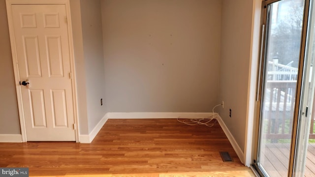 unfurnished room with light wood-type flooring