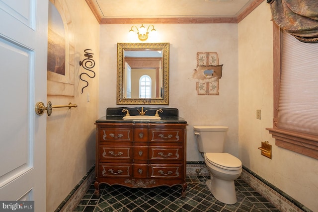 half bathroom with baseboards, visible vents, toilet, ornamental molding, and vanity