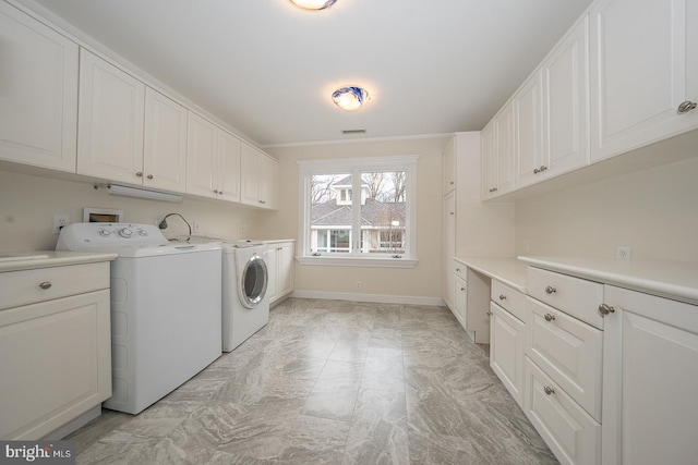 laundry room with baseboards, cabinet space, visible vents, and washing machine and clothes dryer