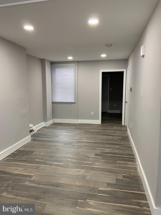 empty room featuring dark wood-type flooring