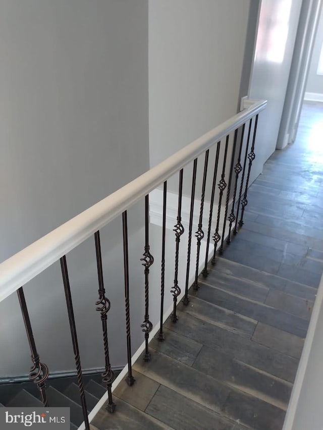 stairs with hardwood / wood-style floors