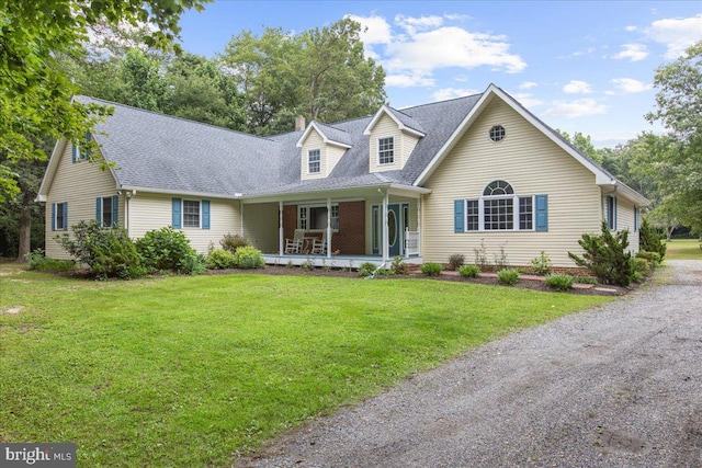 cape cod house featuring a porch and a front yard