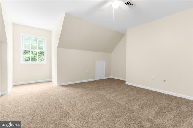 bonus room featuring carpet flooring, ceiling fan, and vaulted ceiling