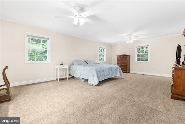 bedroom featuring multiple windows, carpet floors, and ceiling fan