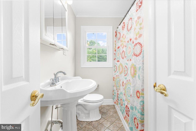 bathroom featuring walk in shower, toilet, tile patterned flooring, and ornamental molding