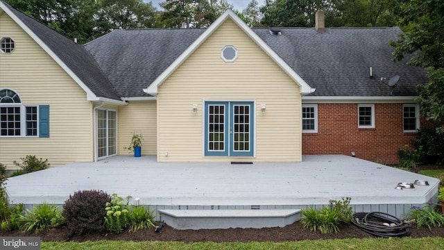 back of property featuring a deck