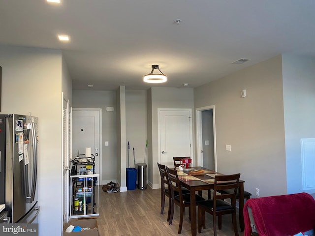 dining room with hardwood / wood-style flooring