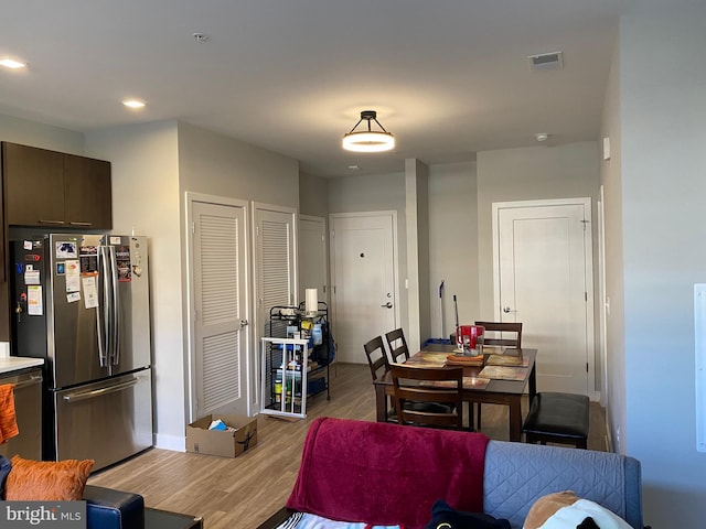 dining room with light wood-type flooring