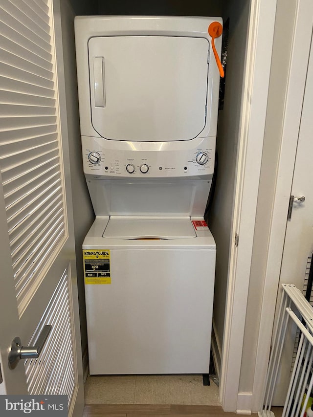 laundry area featuring stacked washer and clothes dryer