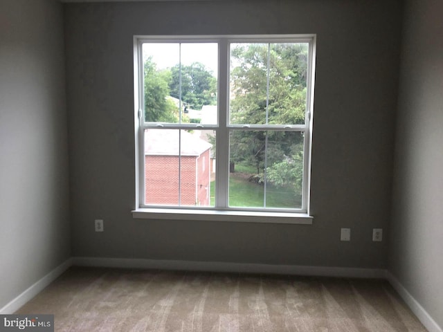 view of carpeted spare room