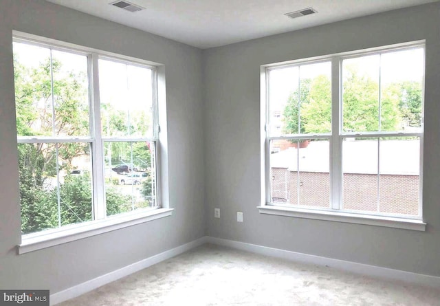 spare room with plenty of natural light