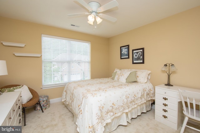 bedroom with light carpet and ceiling fan